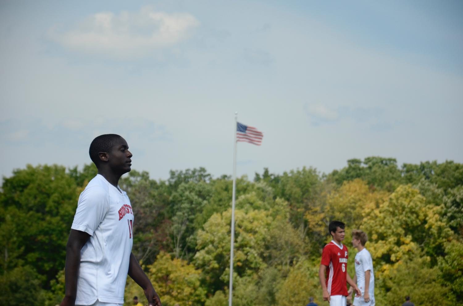 Chris Tiako, sophomore, watches his teammates from the other end of the field. 