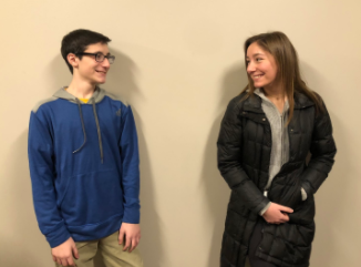 Isabella and Mike Bonfiglio laugh at one another in the hallway between classes. 