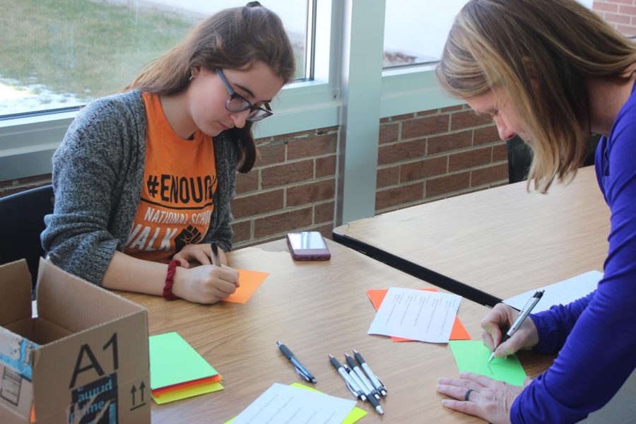 Isabel Klemmer, sophomore, and Mrs. Susie Godfrey, Physical Education teacher, write letters to state legislators. 
