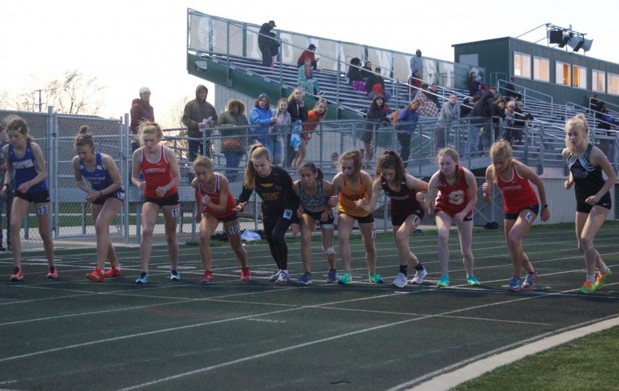 Runners line up for the girls 3200 meter run.