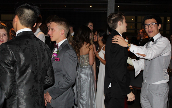 Andrew Shih and John Stoker, Class of 20, dance together at prom in 2019. This was the last prom event held before the pandemic.