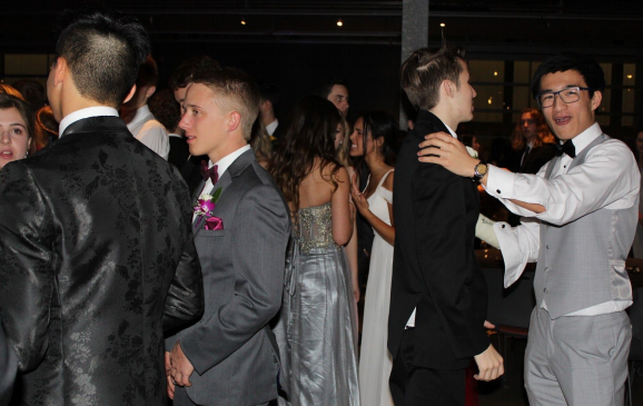 Andrew Shih and John Stoker, Class of '20, dance together at prom in 2019. This was the last prom event held before the pandemic.