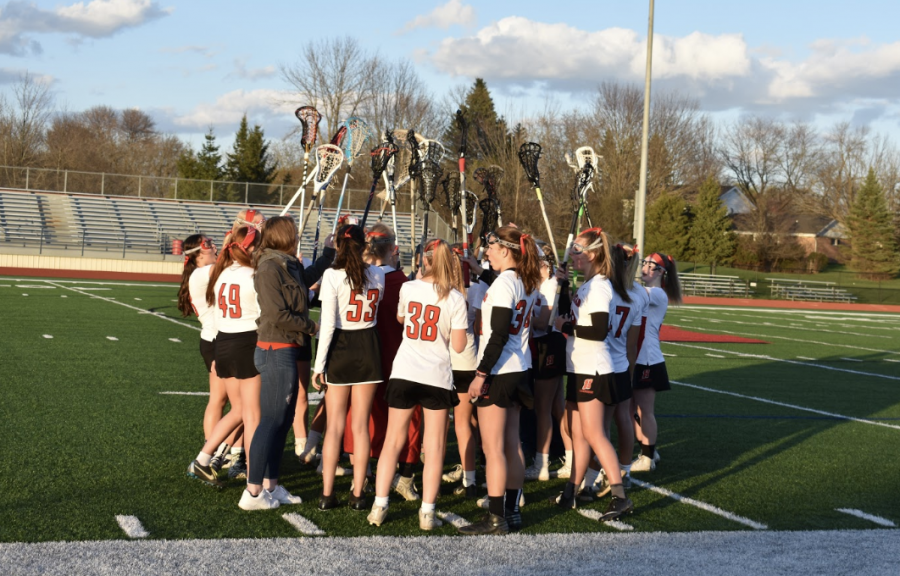 Homesteads Girls Lacrosse team prepares to reenter the field in a home game against Wauwatosa.