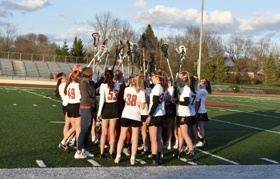 Homesteads+Girls+Lacrosse+team+prepares+to+reenter+the+field+in+a+home+game+against+Wauwatosa.