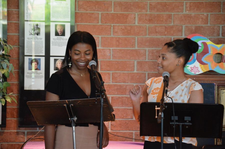 India Wilkerson and Brooke Bell share a laugh while performing a spoken word