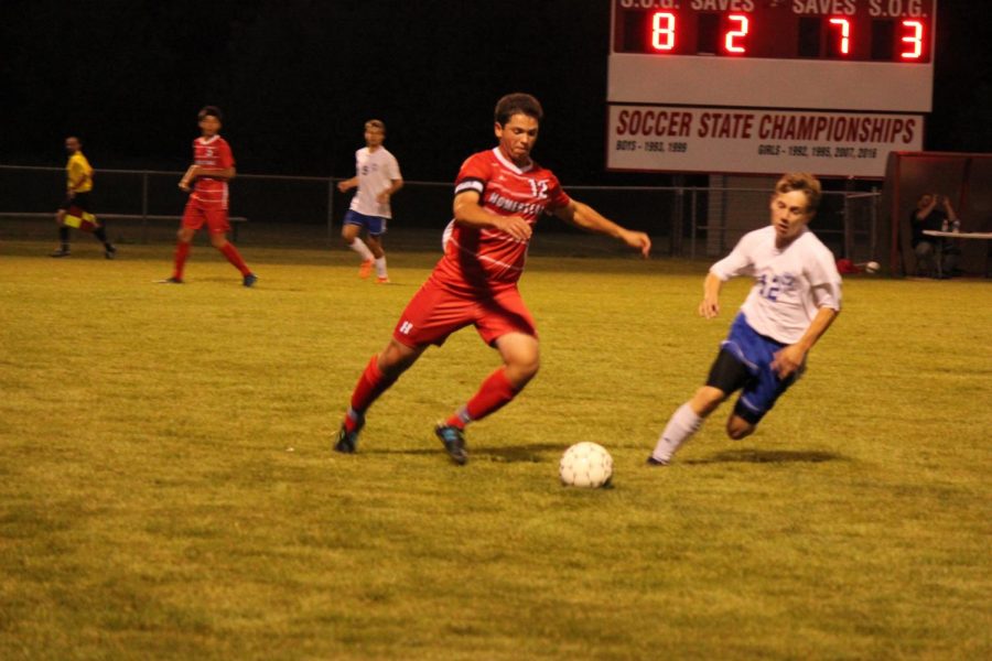 Josh Teplin, senior, dribbles the ball past his opponent during a game earlier in the season.