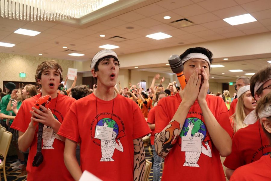 Ilia Mikhailenko, freshman, Jake Schmidman, and Alexander Cai, sophomores, show school spirit at the Wisconsin Junior Classical League convention.