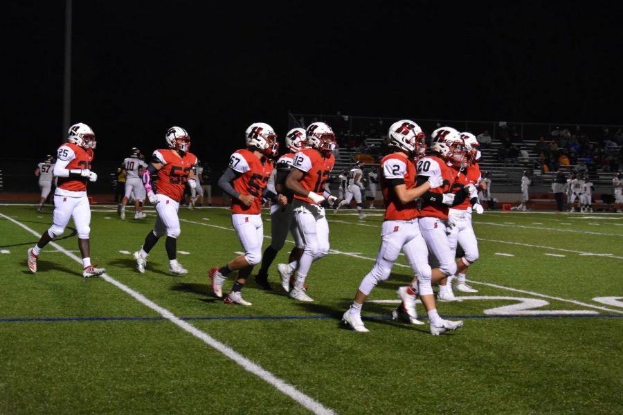 Homesteads defense runs off the field during the first quarter of Fridays football game. 