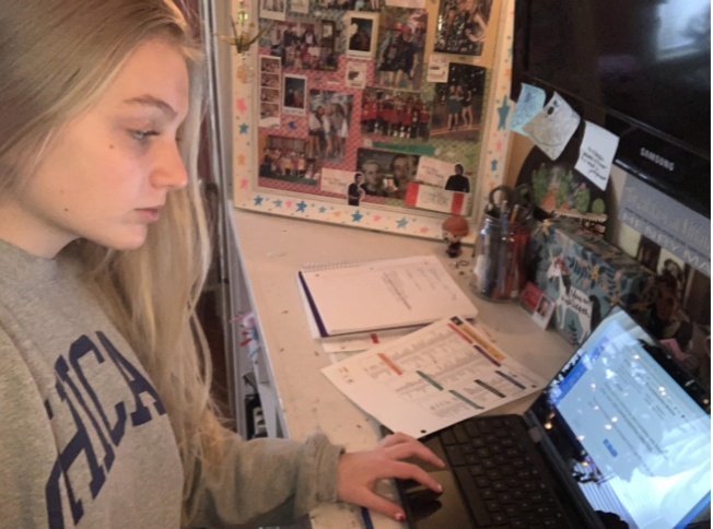 Greta Diehl, sophomore, completes her Spanish class work from home. Diehl’s family decided that online learning would be the safest option for them in order to help lower the risk of bringing COVID-19 into their home. “Working on school at home gets tough when you have to train your brain to focus in an environment that you usually relax in. Other than that, it has not had many negative effects on me,” Diehl said.