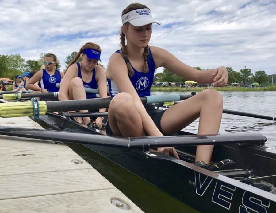 Cate Hering, junior, prepares to race with her teammates at a competition prior to COVID-19. 