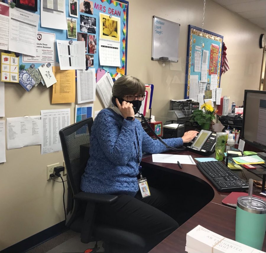 Linda Dean in the attendance office operates the school phones for daily announcements.