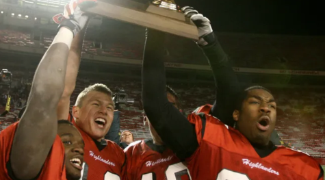 Shelby Harris (right) and teammates raise the Division 1 Championship trophy in 2008. 
