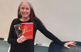 Angelina Cicero, English teacher and department chair, poses with her favorite books. 