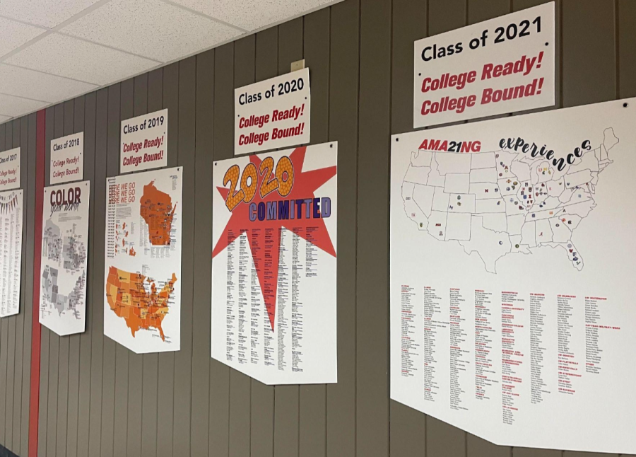 Years of past college decisions made by seniors hang on display in the hallways.
