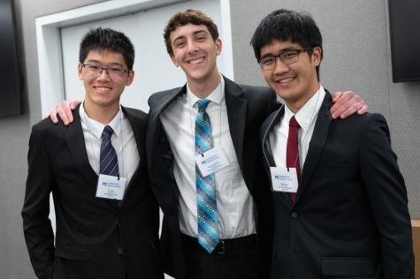 Wan, Schmidman, and Wang grin at the competitions final event in New York City. 