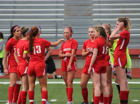 The girls huddle to discuss a game plan during their home game against Whitefish Bay.