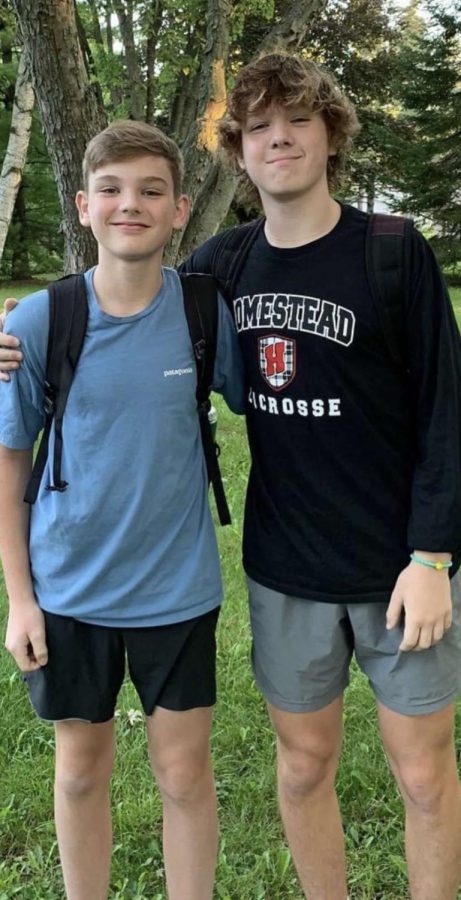 Andrew Pound smiles with his older brother on the first day of school.