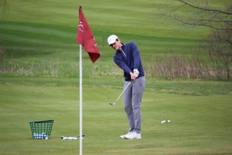 Oliver Maleki, senior, works on his chipping during a practice at River Club of Mequon.
