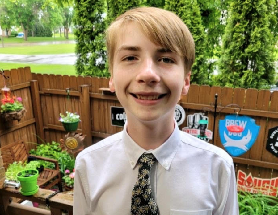Weston Eichmeier poses for a photo before his 8th-grade promotion ceremony.