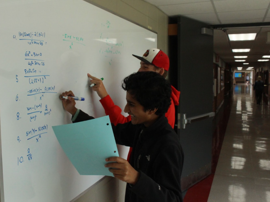 Siddharth Kosaraju, freshman, does practice problems in AP Calculus AB with Jack Bell, sophomore.