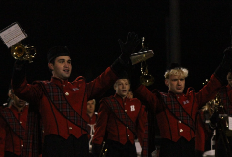 Logan Kuck, freshman, (center) plays in the Homestead Marching Band at a football game with Zach Meyer, senior (right) and Jacob Peterson, senior (left).