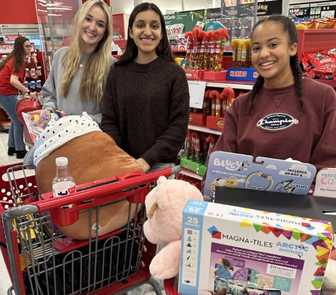 Student Council Vice-President Anastasia Raykova, senior, Student Council Treasurer Hana Nasir, senior, and Student Council member Alex Gaskin, sophomore, shop at Target for toys for the Toy Drive. 