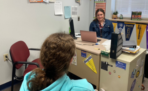 Ms. Navarre can often be found speaking with students in her office.