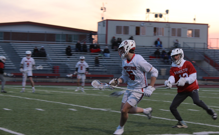 Cole Beiser, sophomore, cradles the ball against Hamilton on Thursday, March 23. 