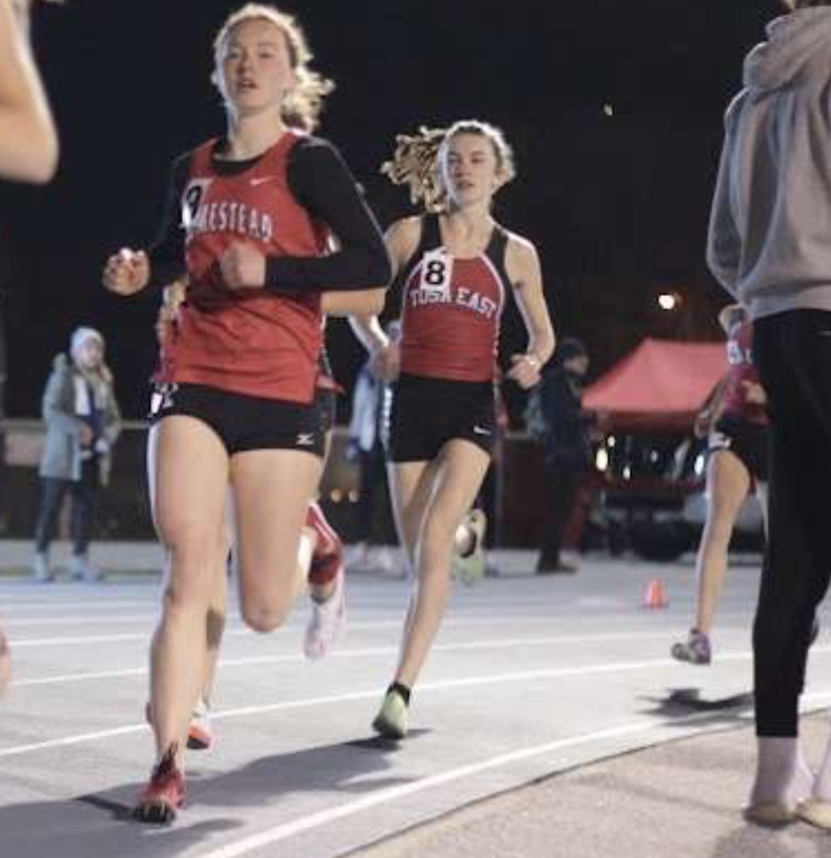 Savannah+Fraley+runs+around+the+curve+of+the+track+during+her+1-mile+run.+