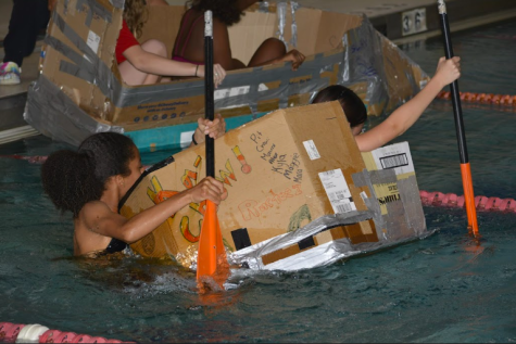 GEMS members realize the limitations of cardboard during boat race.