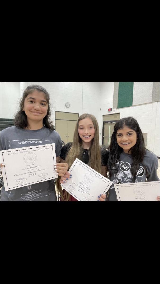 Elizabeth Chagnon (center), freshman, at her middle school promotion award ceremony with Myram Mustafayeva (left), and Safiya Quryshi (right), freshmen.