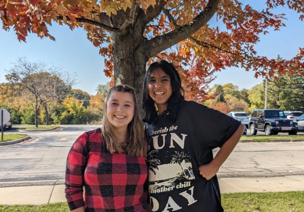Megan Anderson (left), freshman with her friend Aayeshah Singh, freshman during band class 
