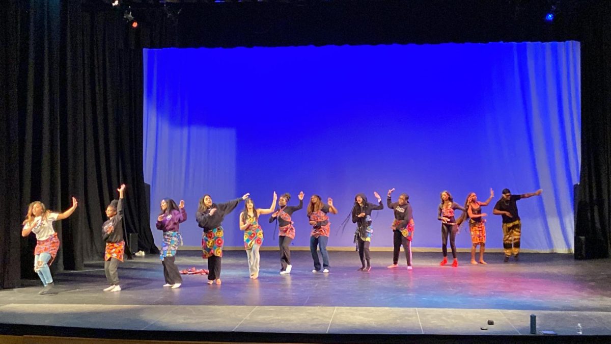 The theatrical dance class prepares their performance for the Black History Month showcase.
