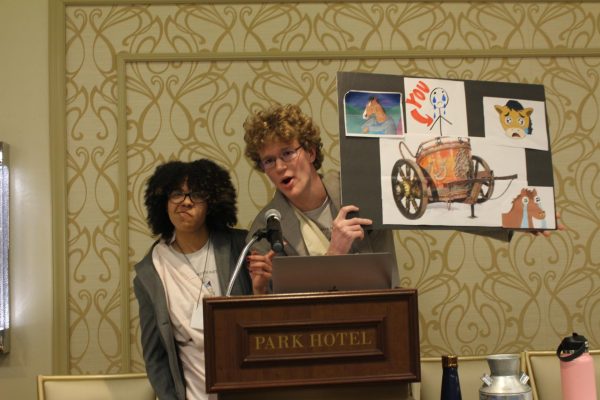 Olivia Rembert and Brian Franks, seniors, perform a skit about chariots in the Roll Call competition.