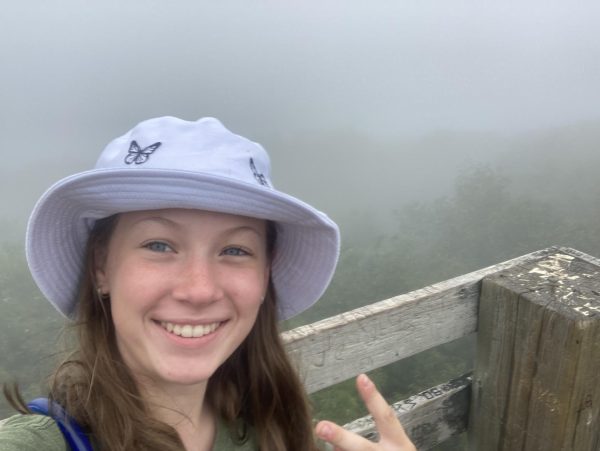Sarah Heller, freshman, stands on top of Summit Peak in the Upper Peninsula
