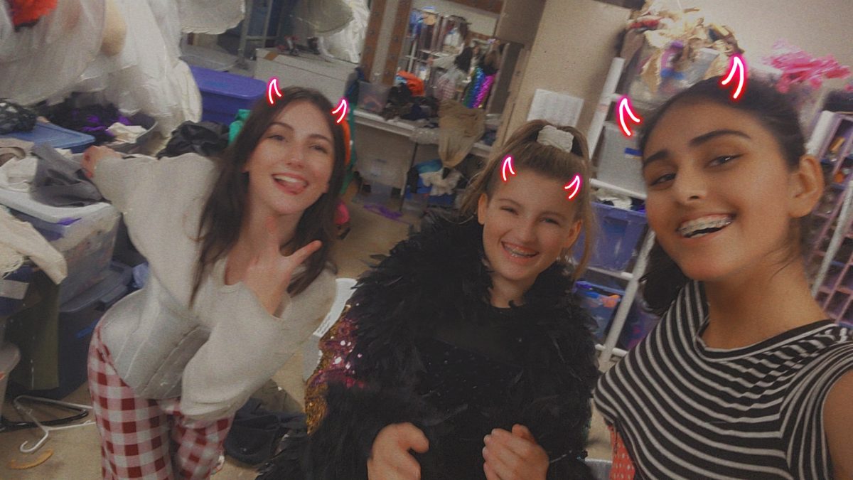 Jaza Khan (right), freshman, tries on costumes with Camryn Bennett and Lillie Hauser, freshmen.