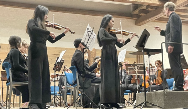 Two chamber orchestra players Alexa Mae Perez, senior, and Sara Cabaniss, senior, play their solos in the Vivaldi concerto.