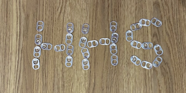 Poptabs, similar to those donated for the drive, are aligned to spell ‘HHS.’ 