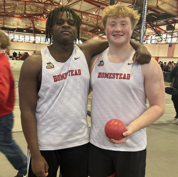 Shot-putters Terron McCall, junior, and Luka Ivancevic, sophomore, pose for the picture at their last indoor meet.
