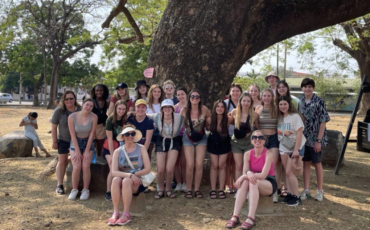 The+group+poses+in+front+of+a+tree+in+a+park+in+Liberia%2C+Western+Costa+Rica.