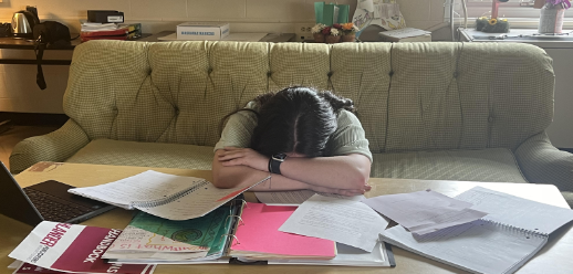 An overwhelmed student falls victim to sleep deprivation at school. 
