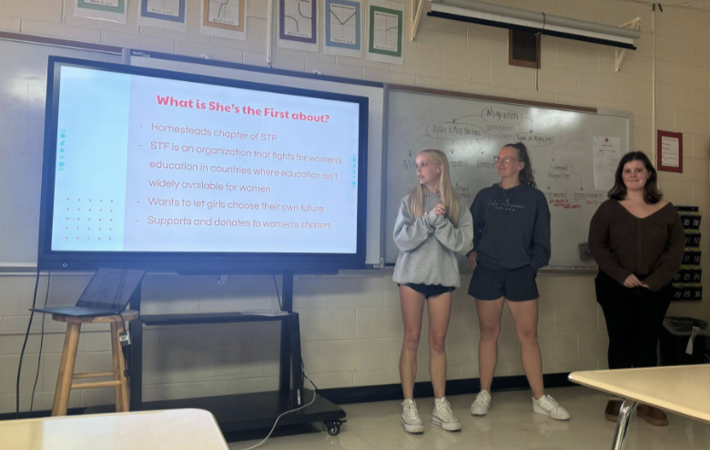 Meredith Niedfeldt, Julia Nill and Cate Sutlif, seniors, present at She’s the First Club’s opening meeting this year.