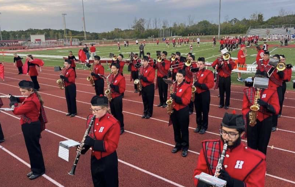 The Highlander marching band performs for pre-game at a Friday night football
game.