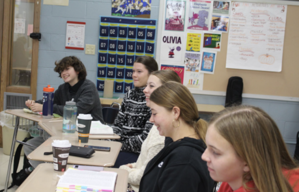 Jacqueline Bergey, sophomore, Georgia Sulsberger, junior, Rachel Anderson, senior, Megan Anderson, sophomore, and Alena McNichol, sophomore, laugh as they discuss Daniel 9 in the Bible.