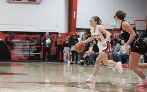 Grace Zortman, senior. scans for a pass in their conference matchup against Cedarburg.