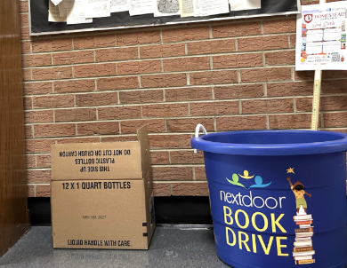 A collection bin for the book drive is available in the Inquiry Wing for donations.