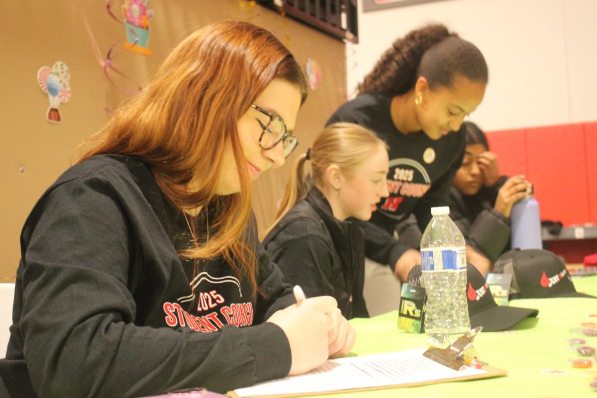 Student Council members help fellow Highlanders sign in during the blood drive.  