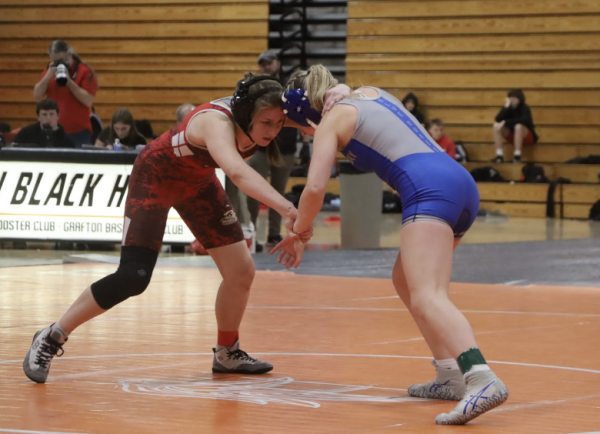 Salome Benson, sophomore, keeps her eyes down on her opponent from Whitefish Bay in her matchup.