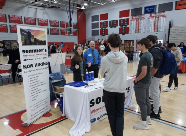 Homestead students Sean Contardi, Luke Lockman and Sam Lanthier talk to professionals from Sommers Automotive.