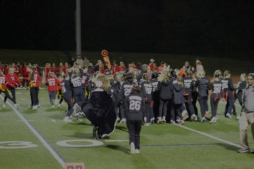 After the seniors won, the team gathered on the field to celebrate their victory